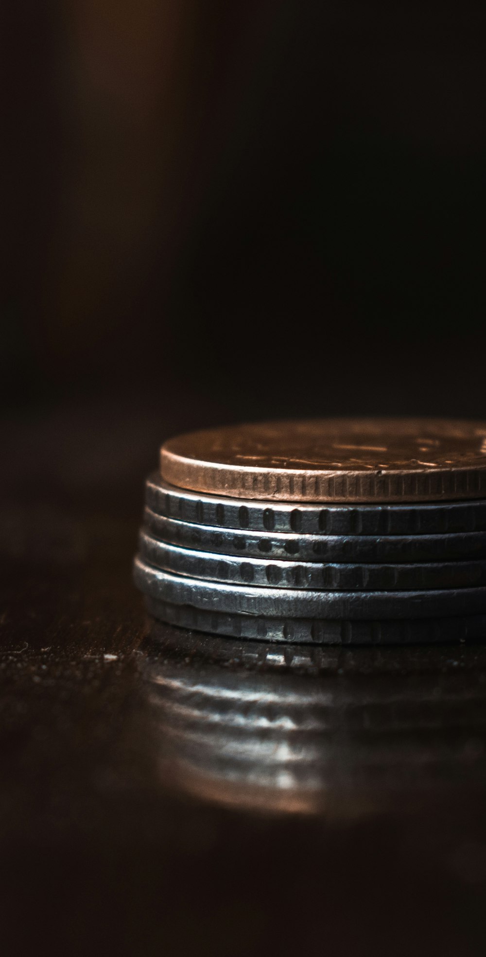 a stack of coins sitting on top of a table