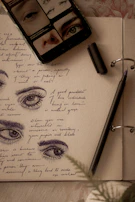Close-up of journal pages filled with reflective notes and sketches.