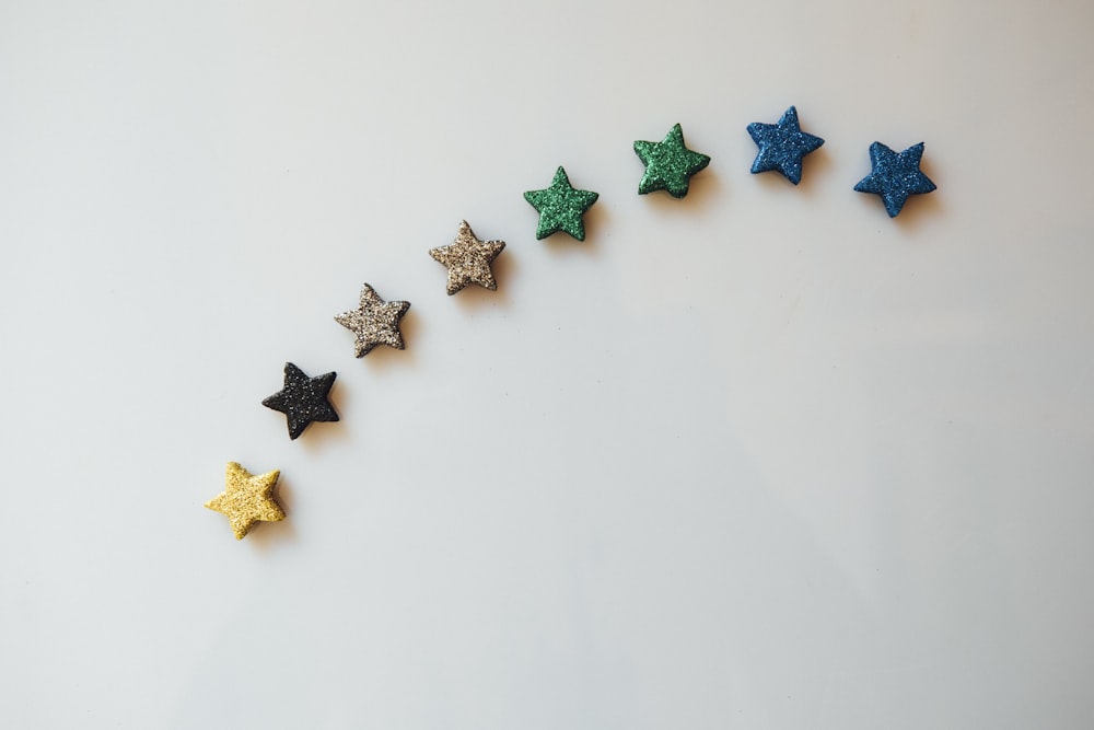 a row of stars sitting on top of a white table