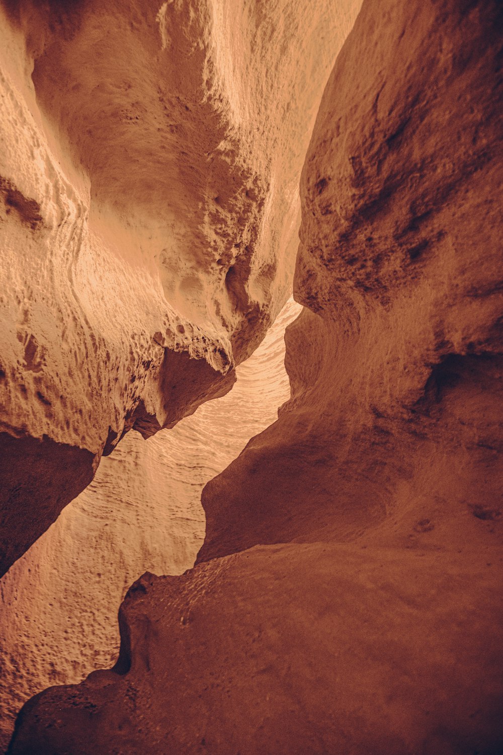 a narrow slot in the side of a mountain