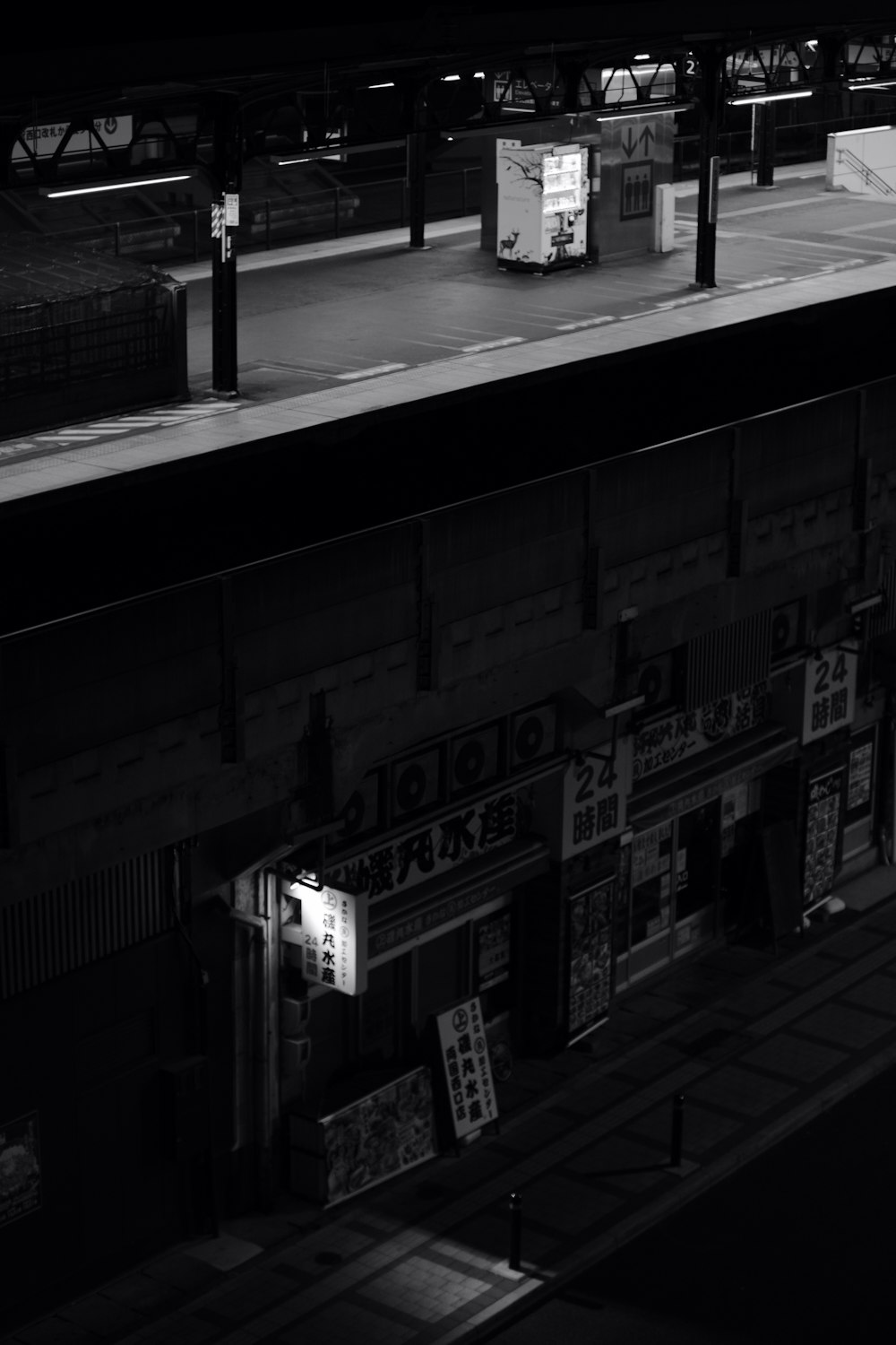 a black and white photo of a building at night