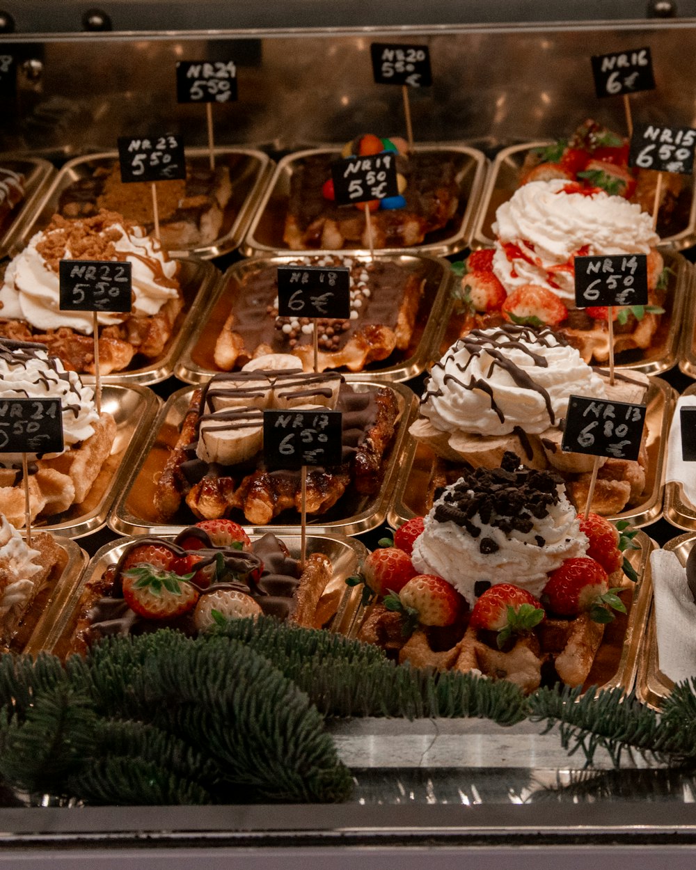 a display case filled with lots of different types of desserts