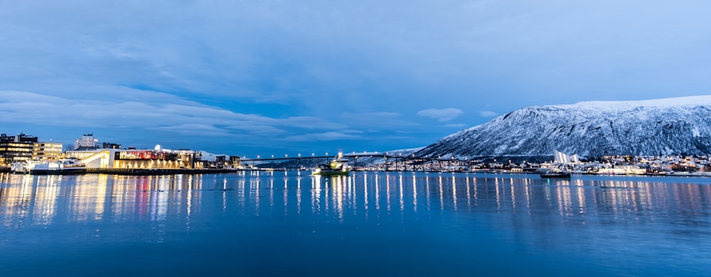 a large body of water with a city in the background