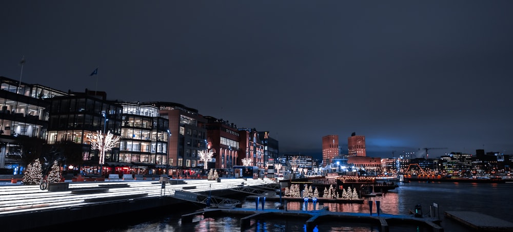 a night time view of a city with a river running through it