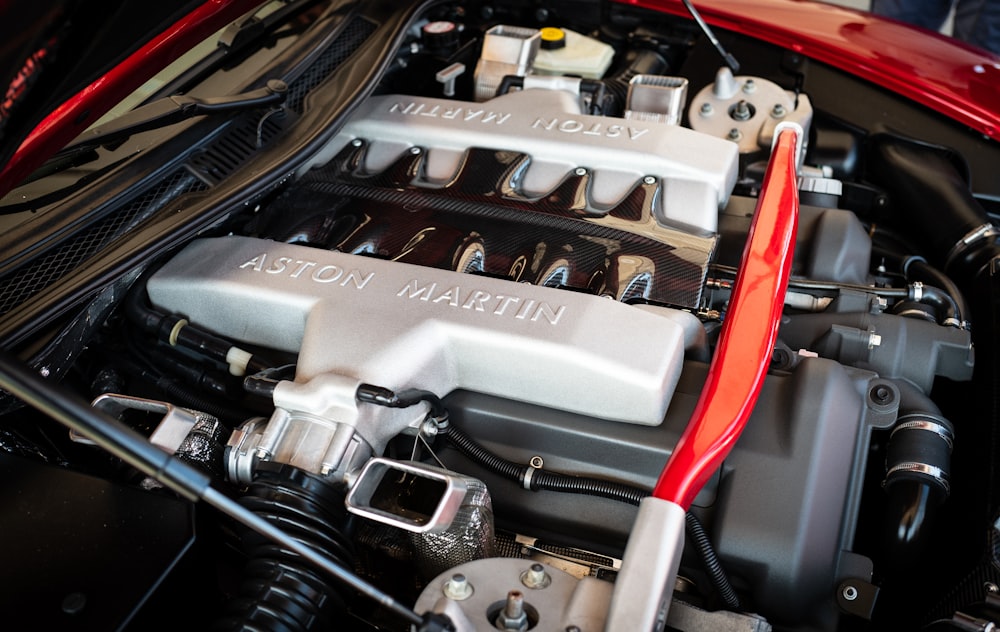 the engine compartment of a red sports car