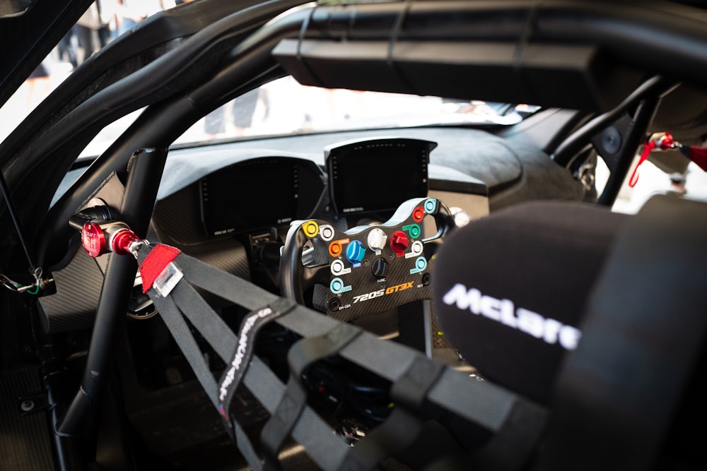 a close up of a car dashboard with a steering wheel