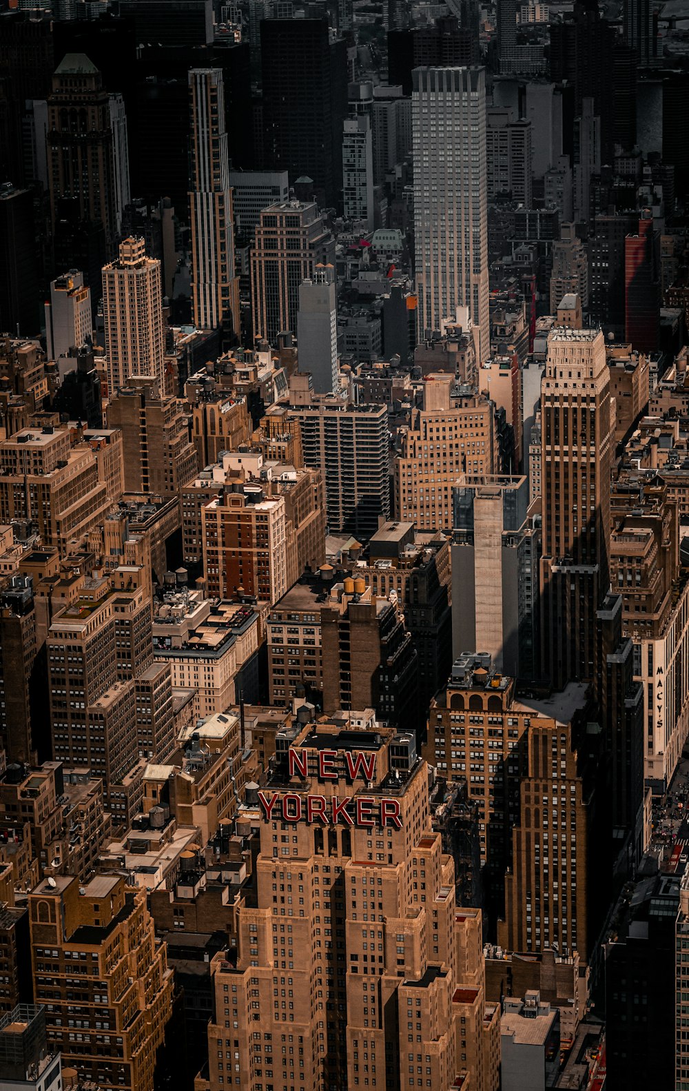 an aerial view of a city with tall buildings