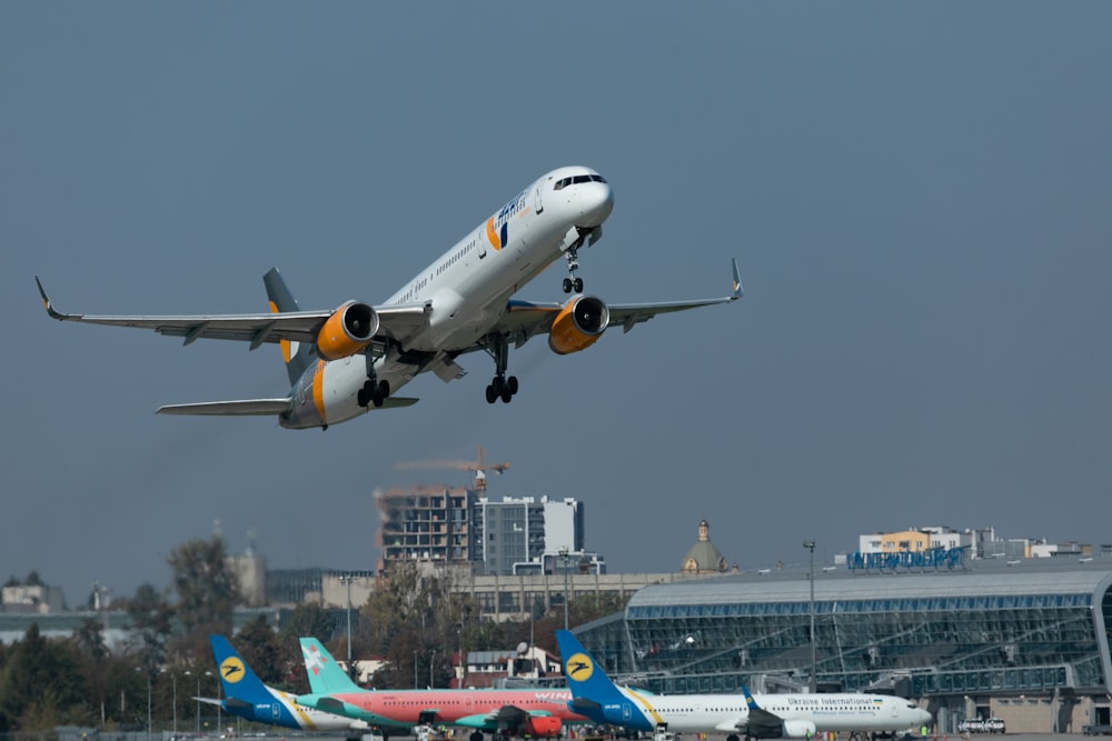 a large jetliner flying through a cloudy sky