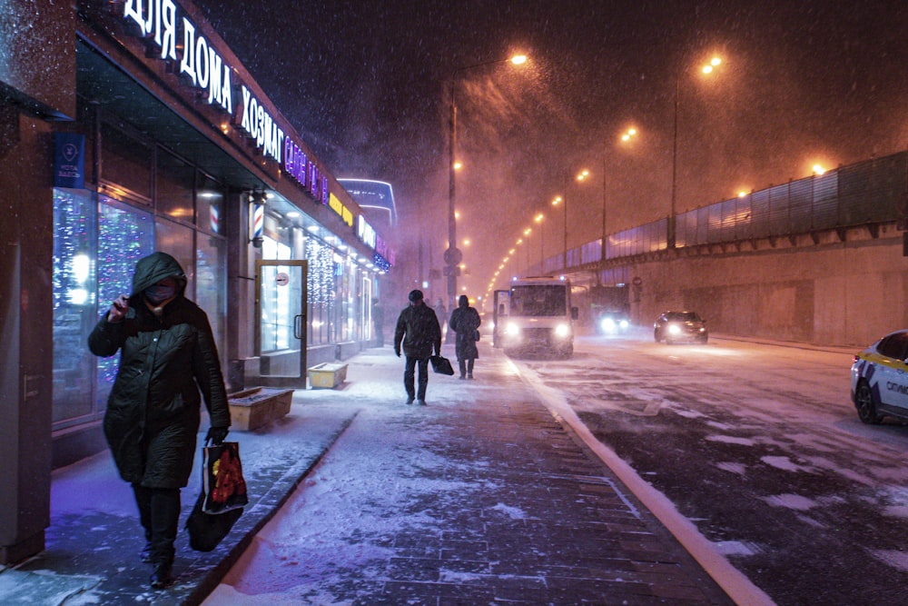 a man standing on a snow board on a city street