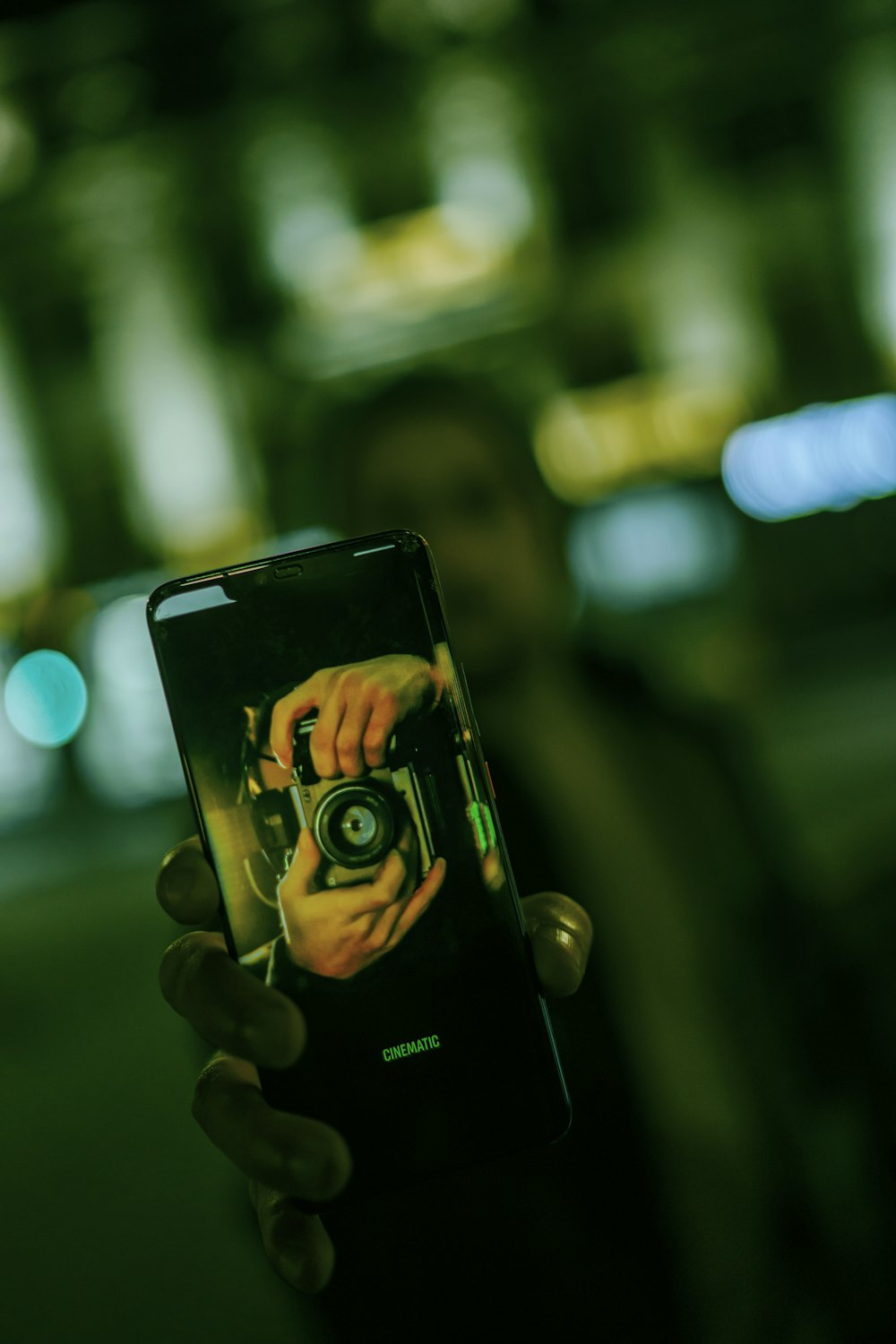 a person taking a picture with a camera