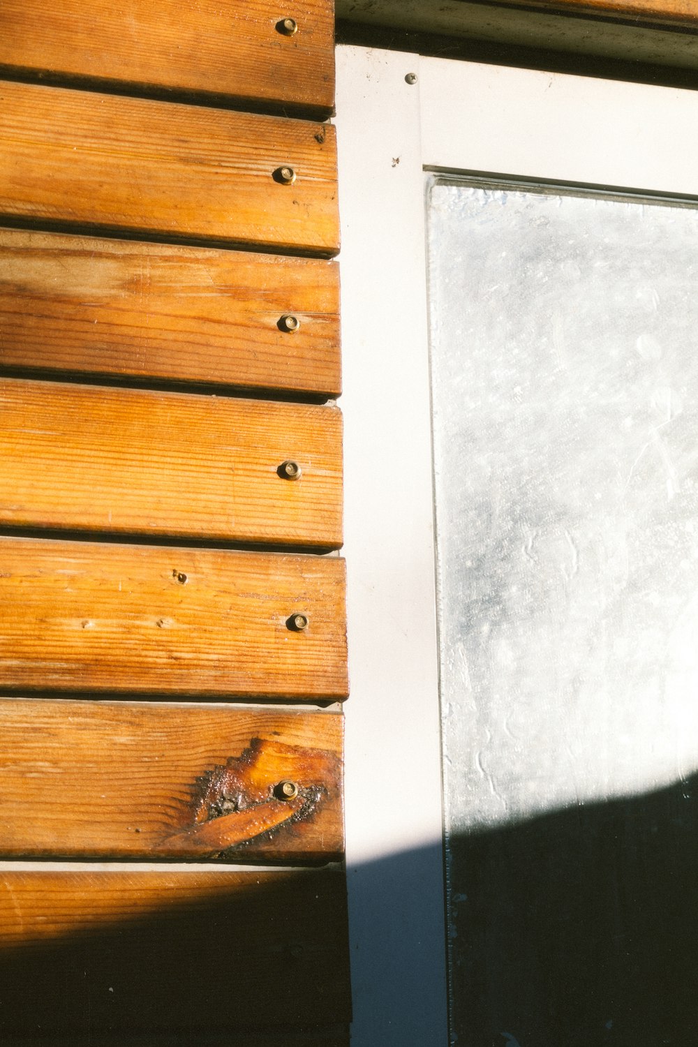 a close up of a window on a wooden building