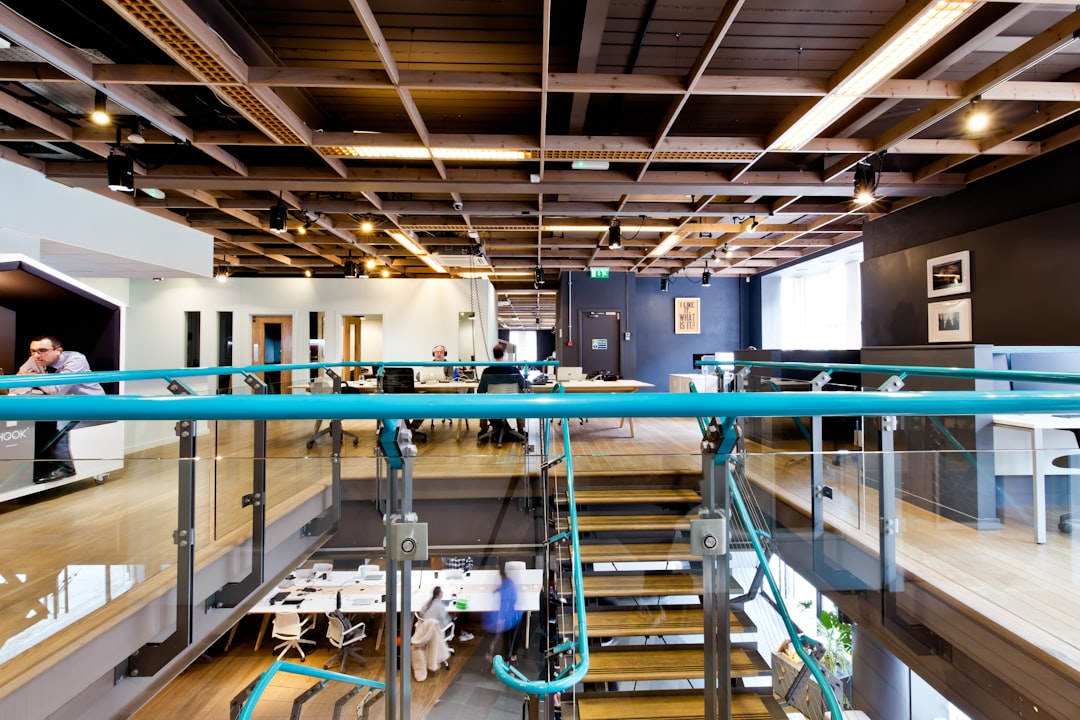 a large open room with a staircase leading up to a second floor,