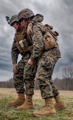 a couple of marines standing next to each other