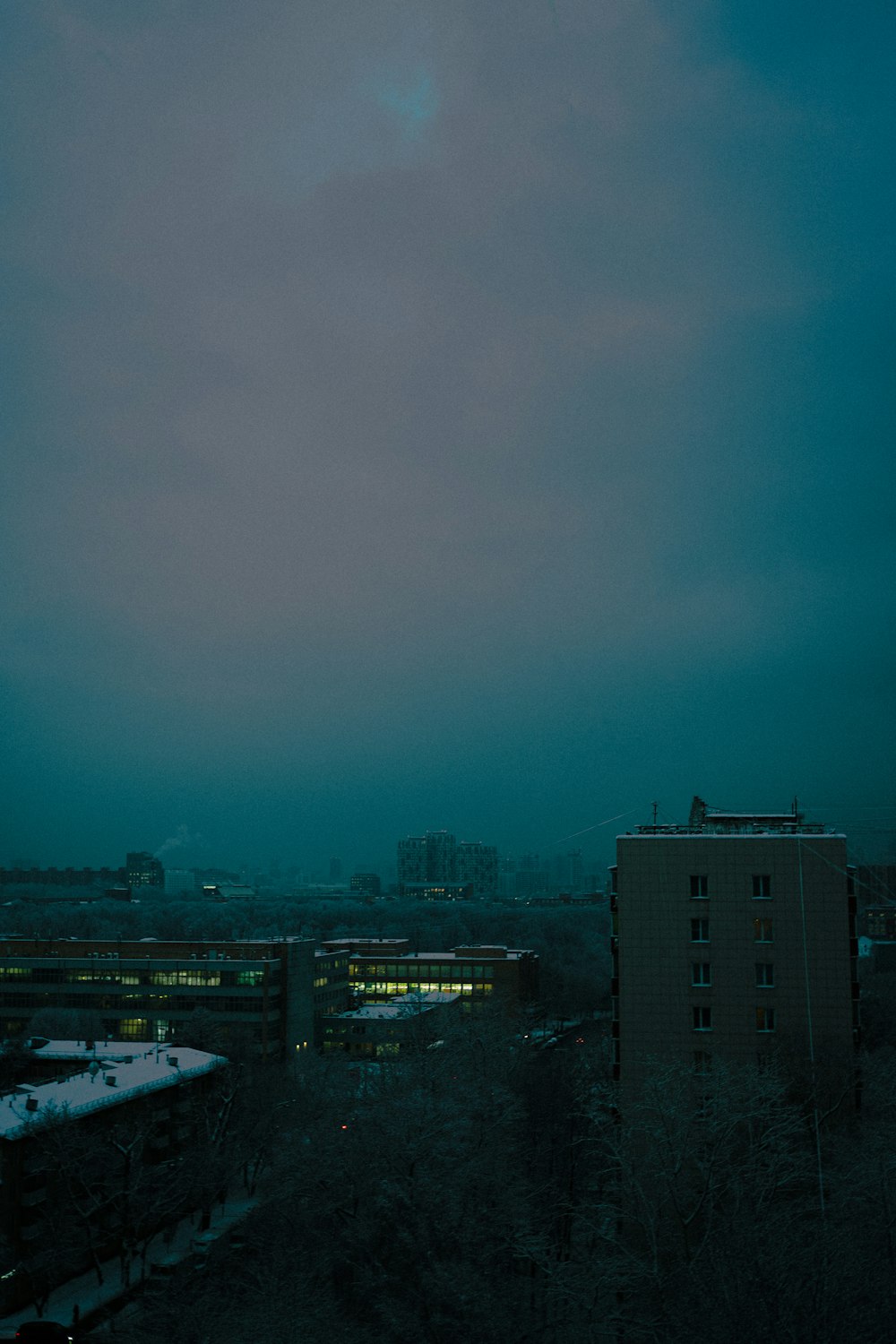 a cloudy sky over a city at night