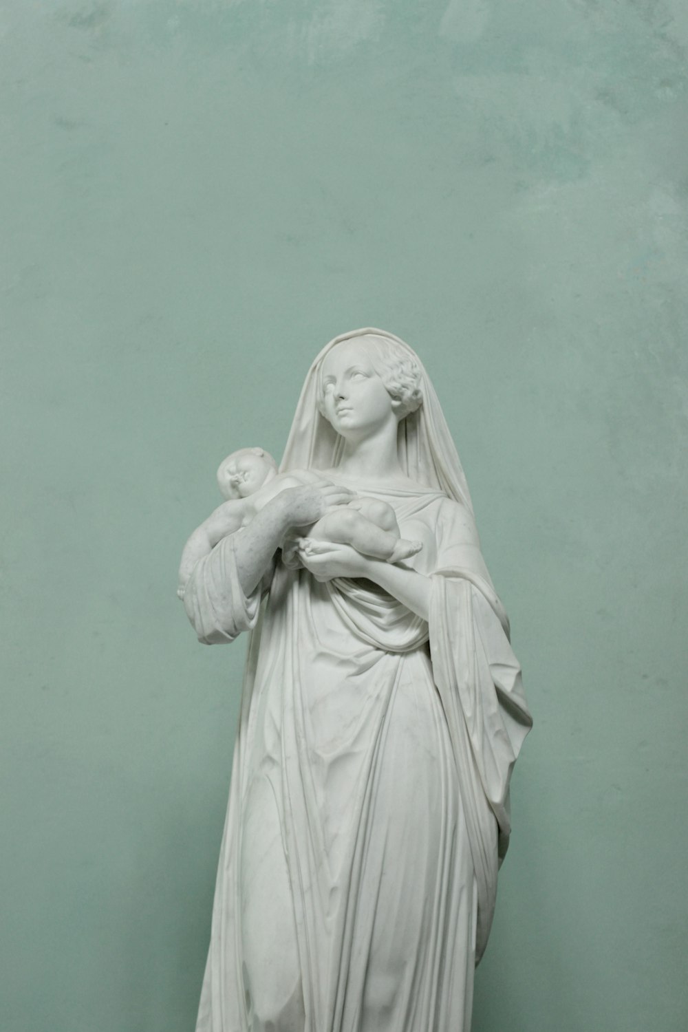 a statue of a woman holding a child