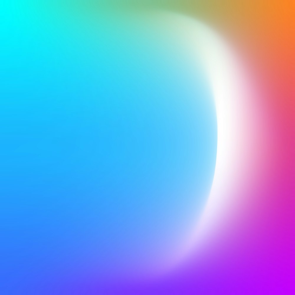 a blurry image of a rainbow colored background