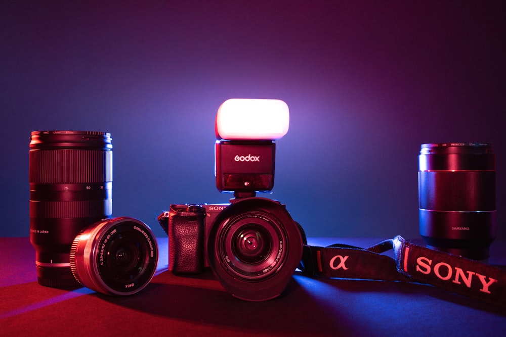 a camera with a flash light sitting on top of it