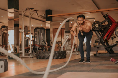 Athlete doing intense cardio workout with sweat and determination visible.