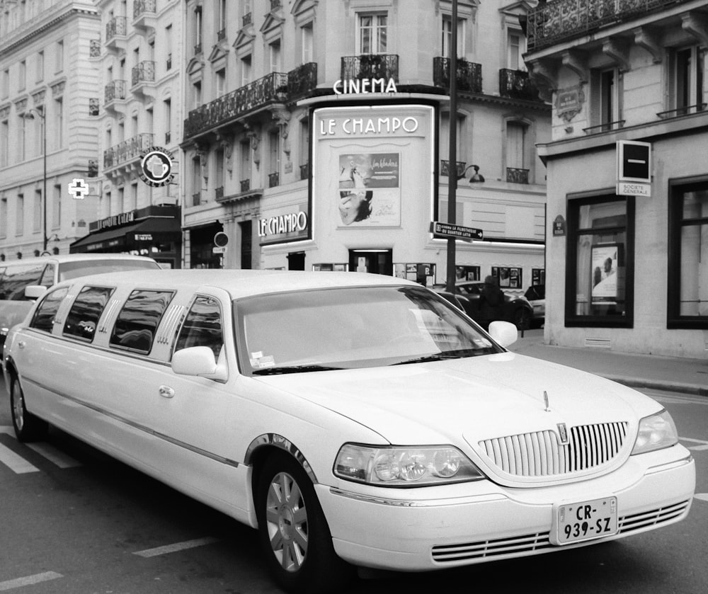 a white limousine parked on the side of the road