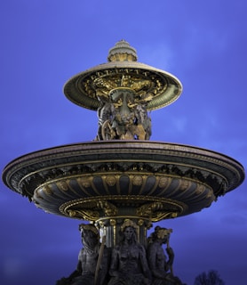 A beautifully crafted marble fountain showcasing intricate designs.