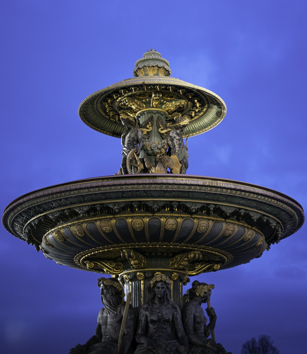 a large fountain with a statue on top of it