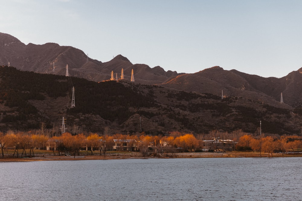 a body of water with mountains in the background