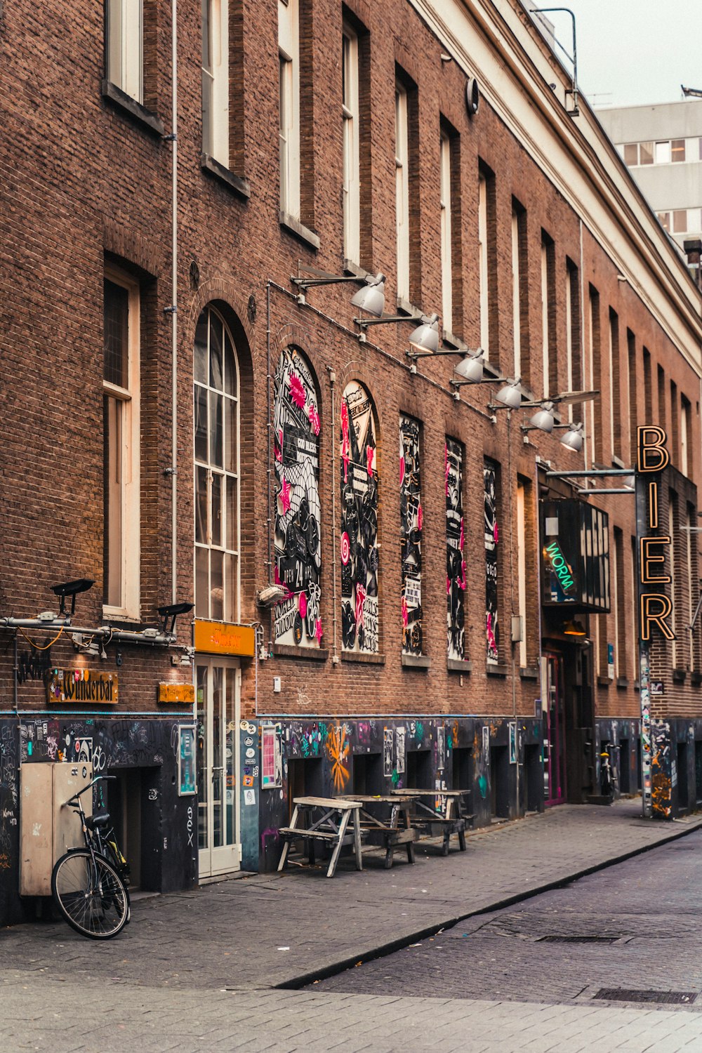 a brick building with a bike parked in front of it