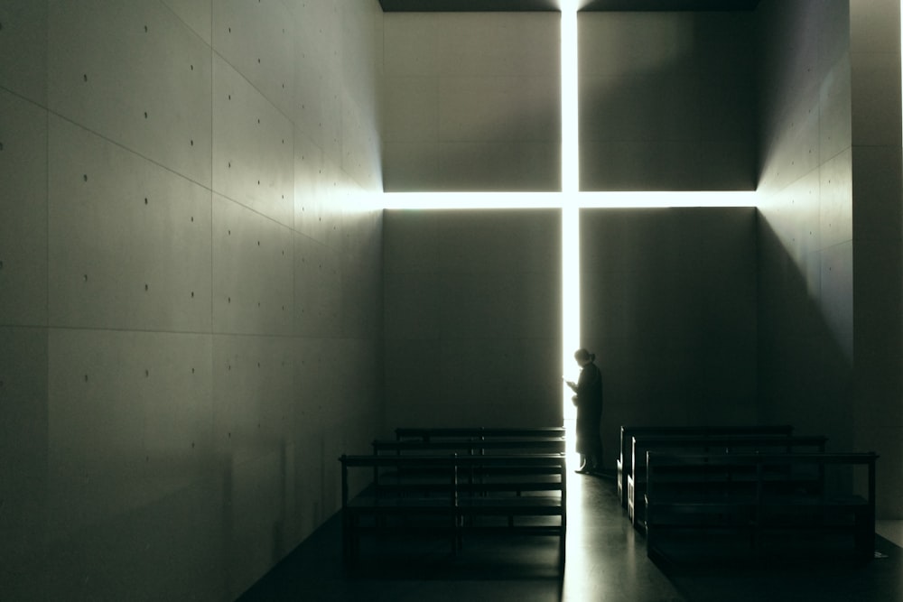 a person standing in a dimly lit room