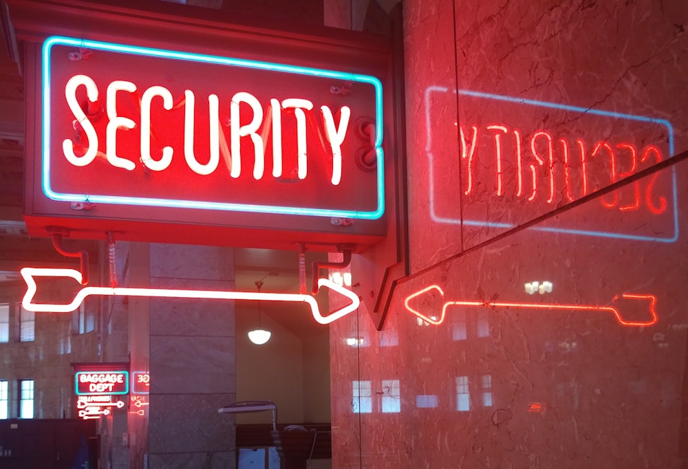 a red security sign and a blue security sign