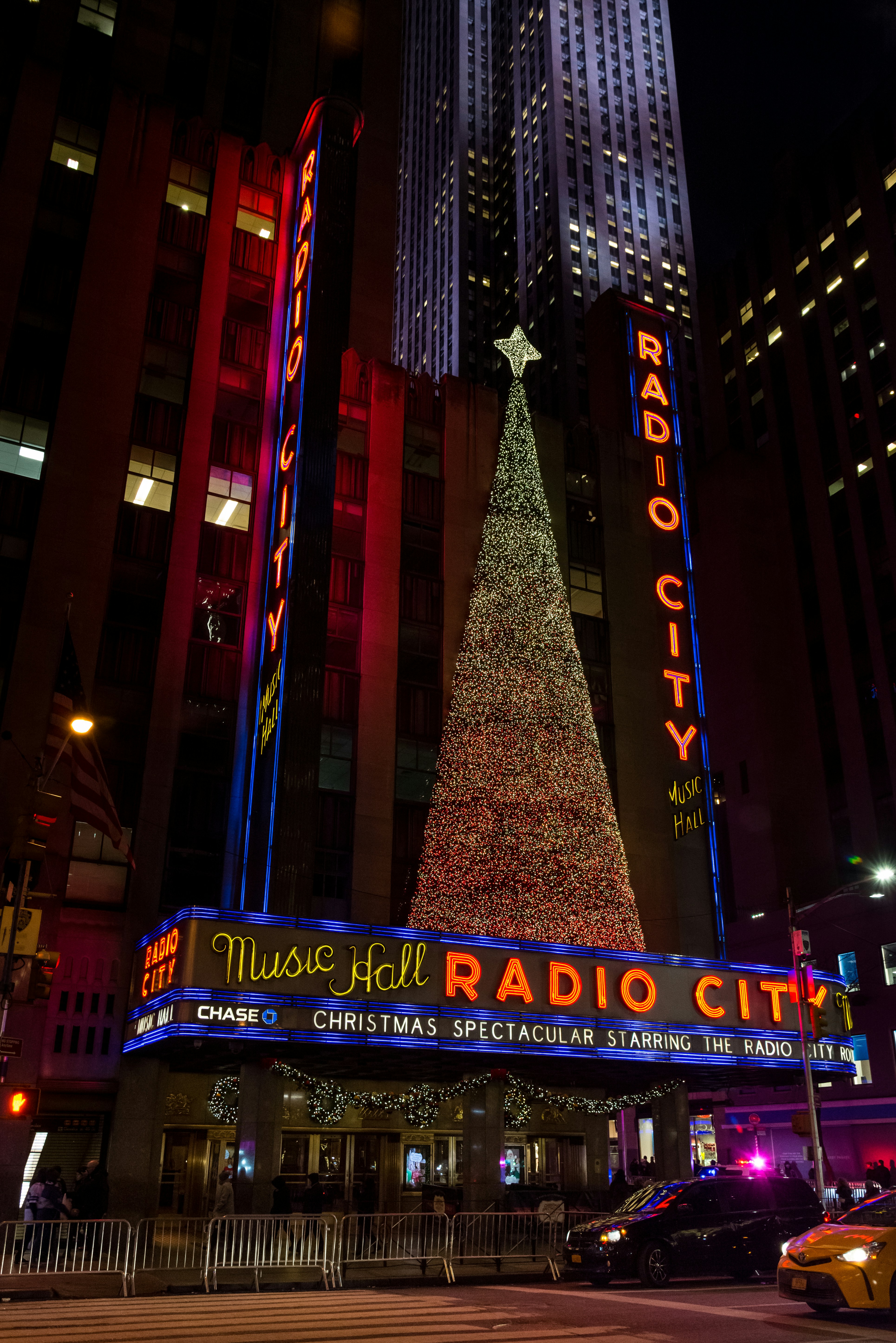 The radio city christmas tree is lit up at night photo Free Radio