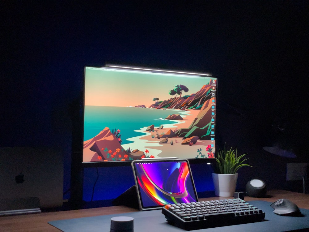 a laptop computer sitting on top of a wooden desk