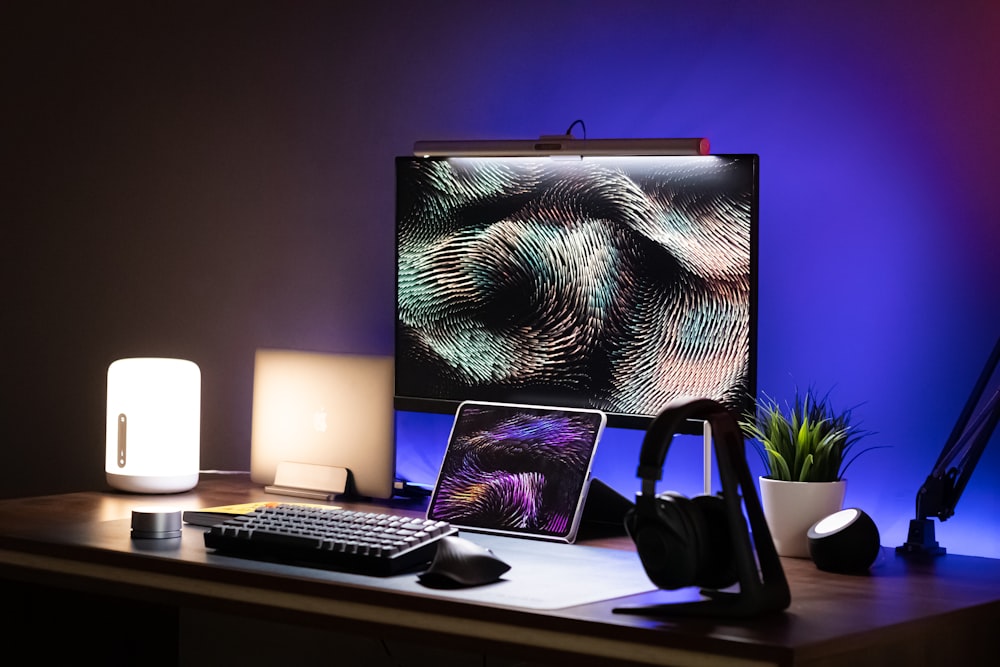 a desktop computer sitting on top of a wooden desk