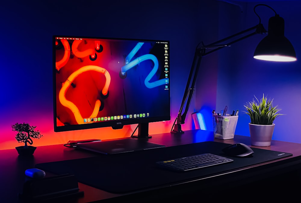 a desktop computer sitting on top of a wooden desk