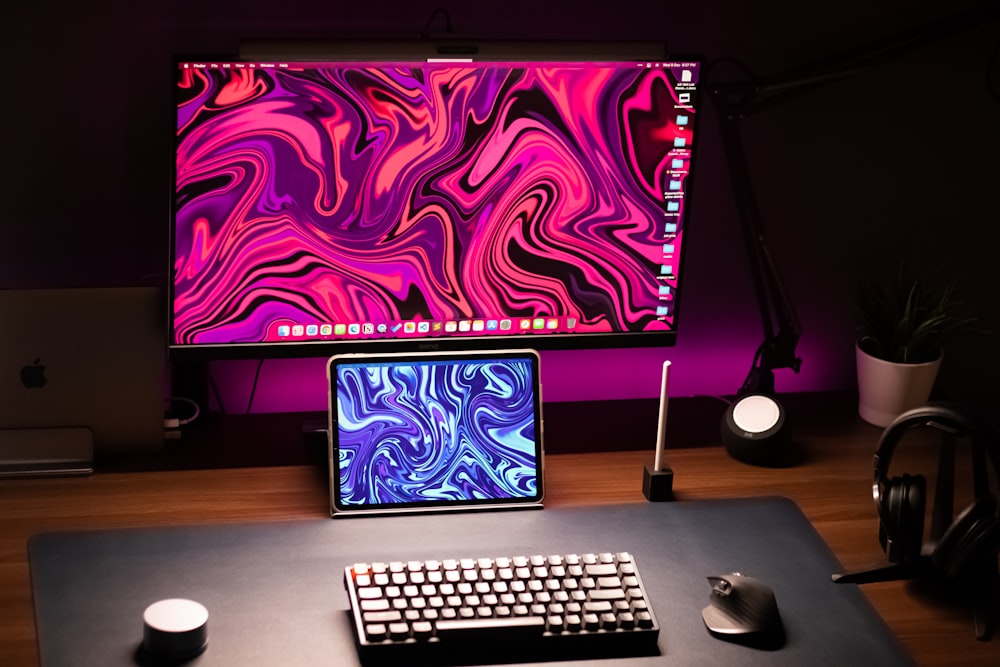 a computer desk with a monitor and keyboard