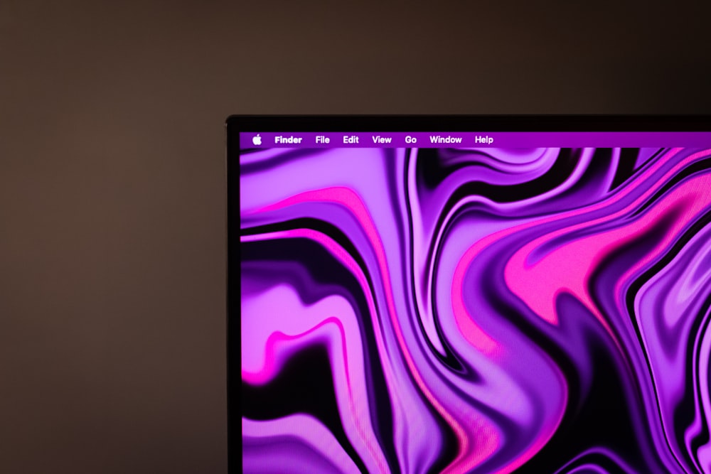 a computer screen with a purple and pink design on it