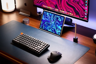 a computer desk with a keyboard, mouse and monitor