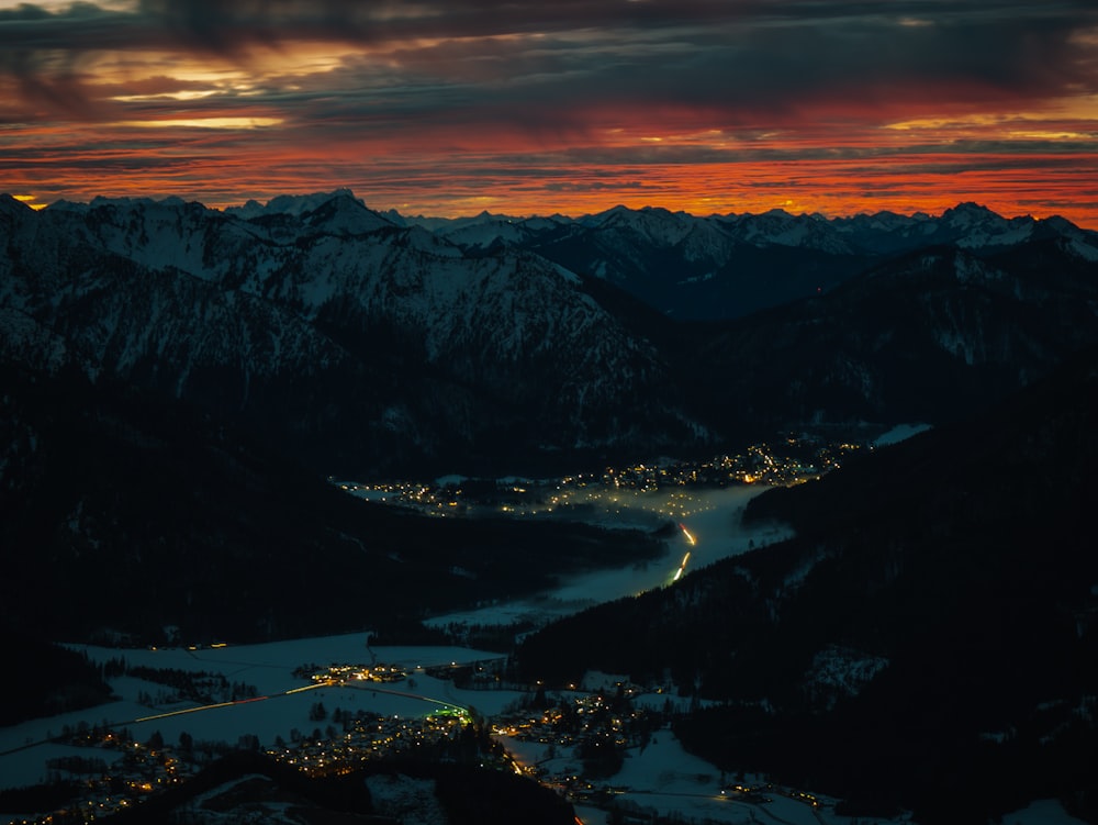 a view of a city and mountains at night