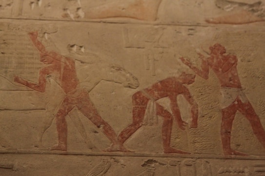 a painting of men playing tennis on a wall