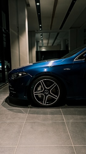 Close-up of a customer happily inspecting a car interior at arabauto showroom.