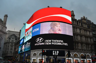 a big building with a lot of billboards on it