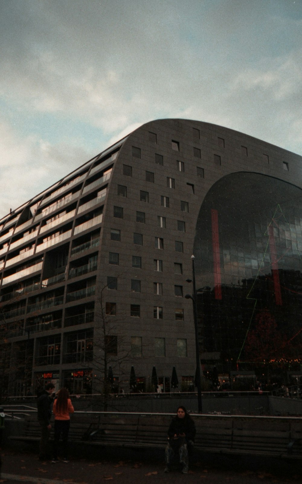 a large building with a very tall glass front