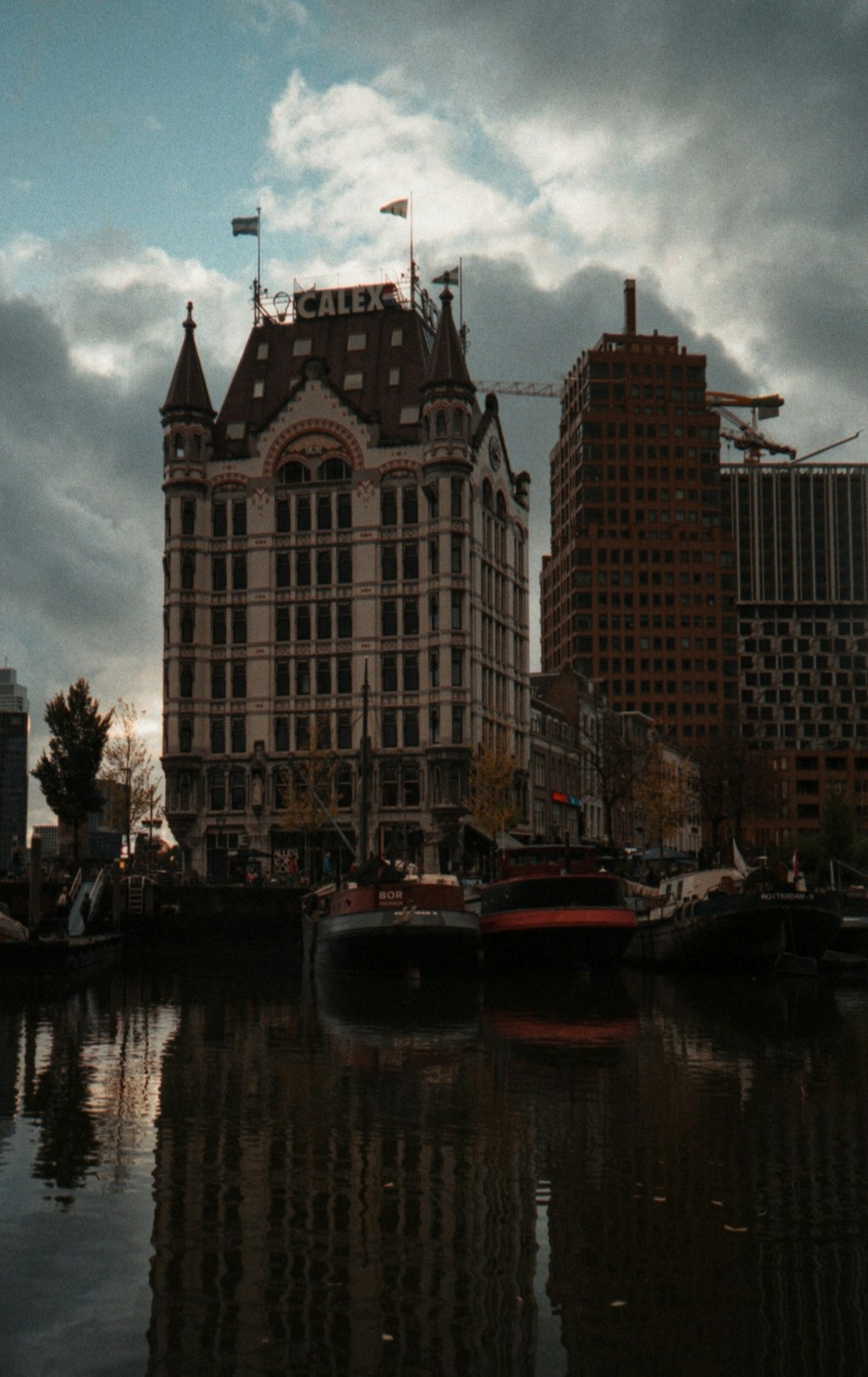 a large building sitting next to a body of water