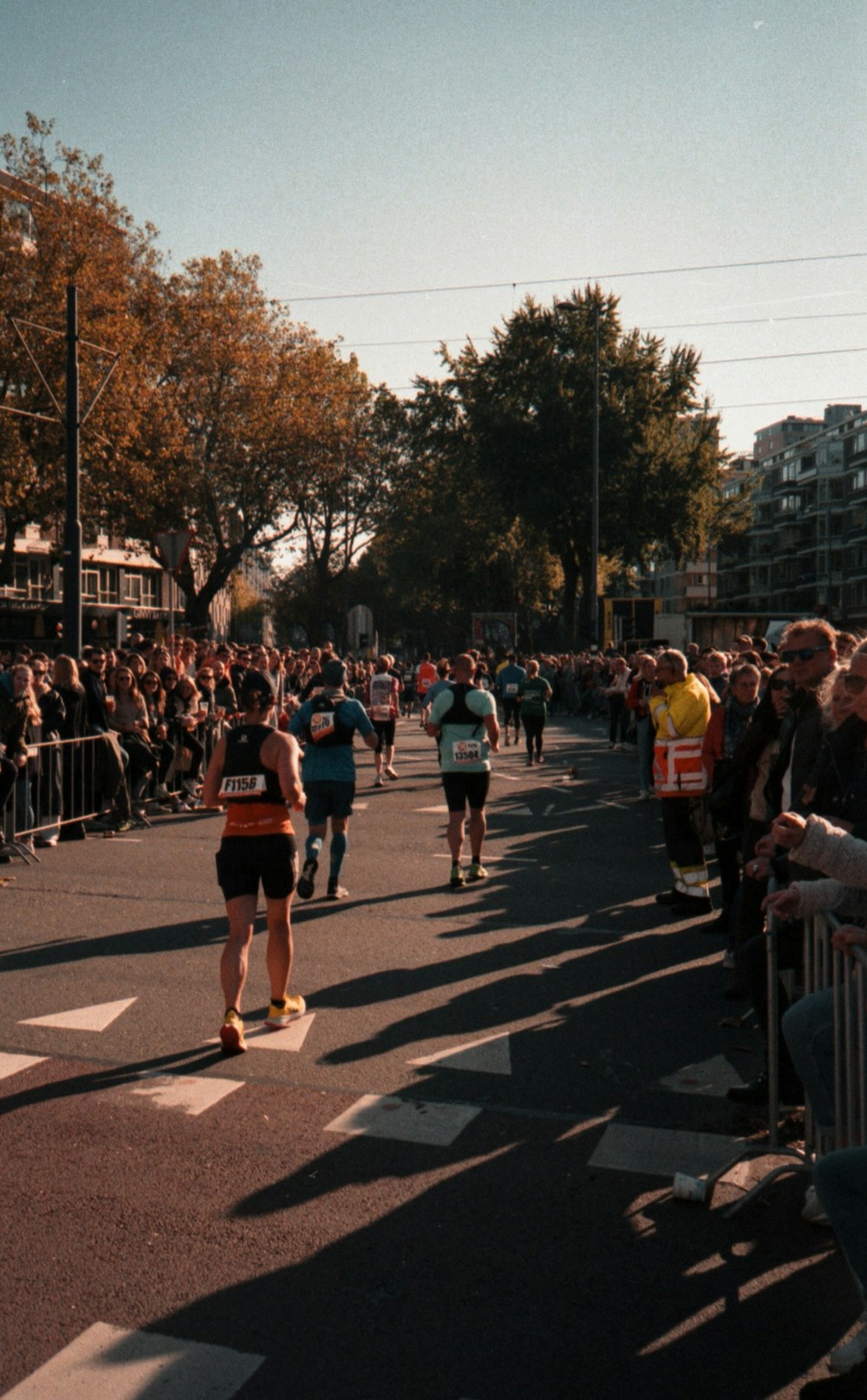 a group of people that are walking down a street