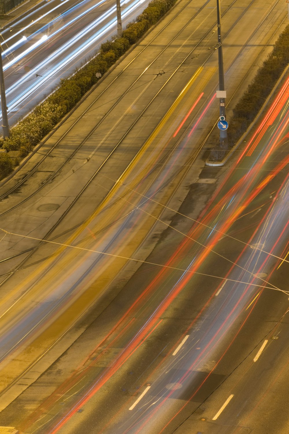 a city street filled with lots of traffic at night