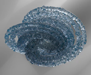 a blue glass bowl sitting on top of a table