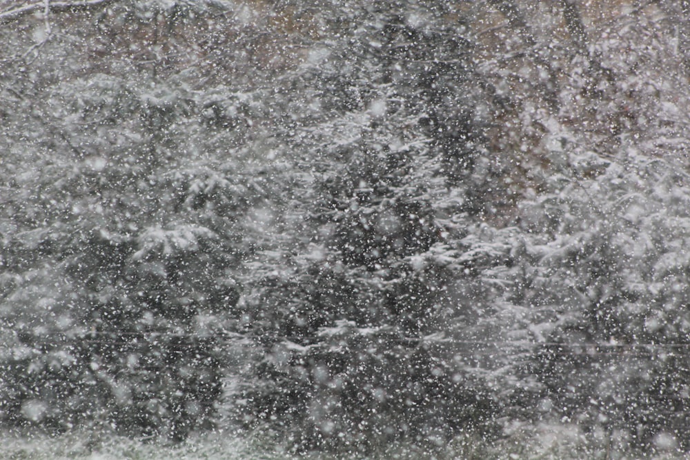 a person walking in the snow with an umbrella