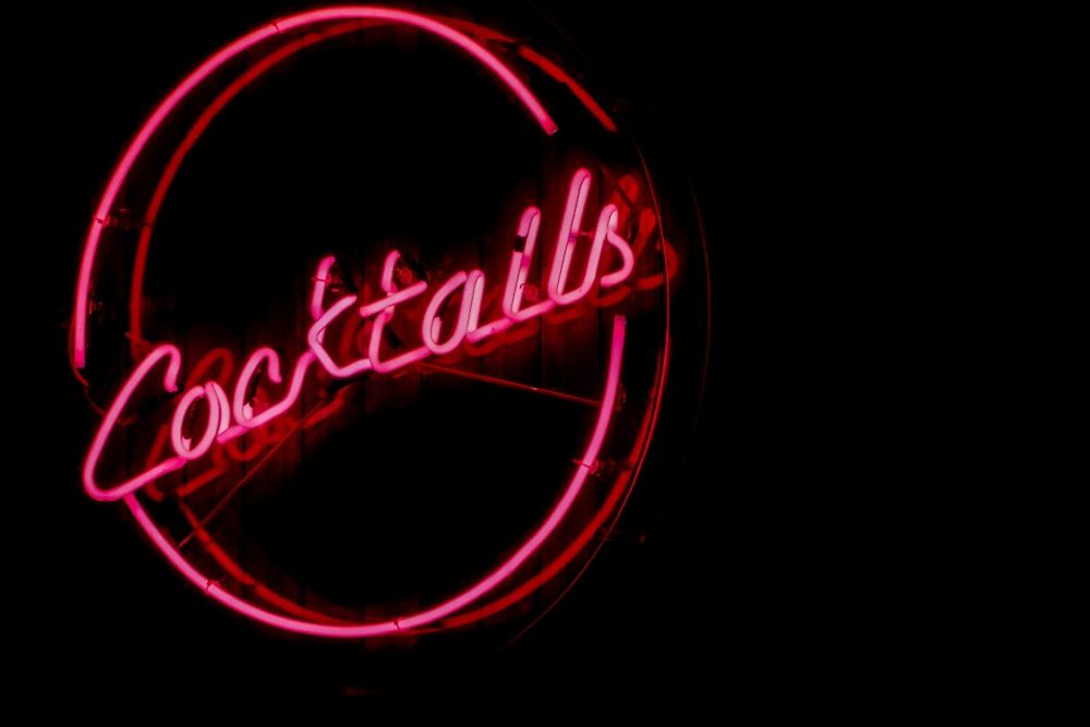 a neon sign that says cocktails on it