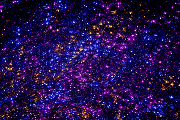 A mystical blend of gold pillars of light intertwined with colorful obsidian sound waves.