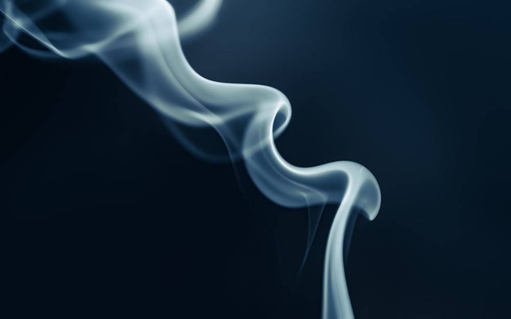 a blue smoke background with white smoke coming out of it