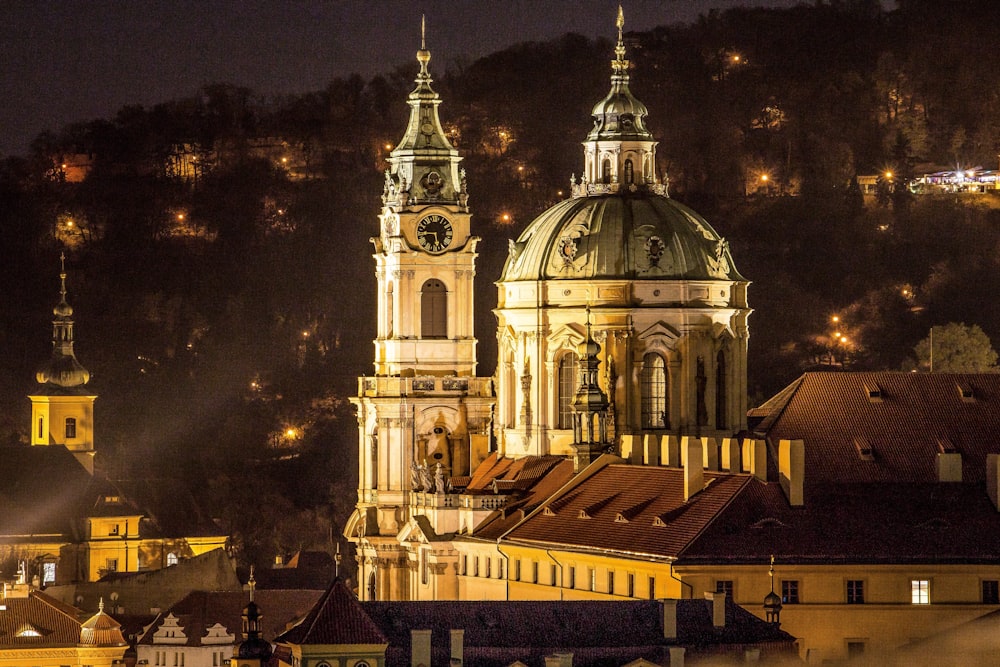 a large building with a clock tower at night